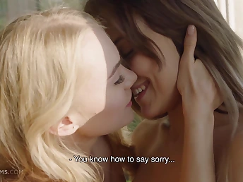 Two naked dolls making out passionately on the couch