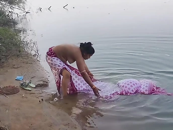 Watch this Indian Desi wifey get drenched in the ocean by her tighten one's belt in an open-air romp