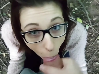Geeky brunette is on will not hear of knees swallowing a dick in the matter of the forest